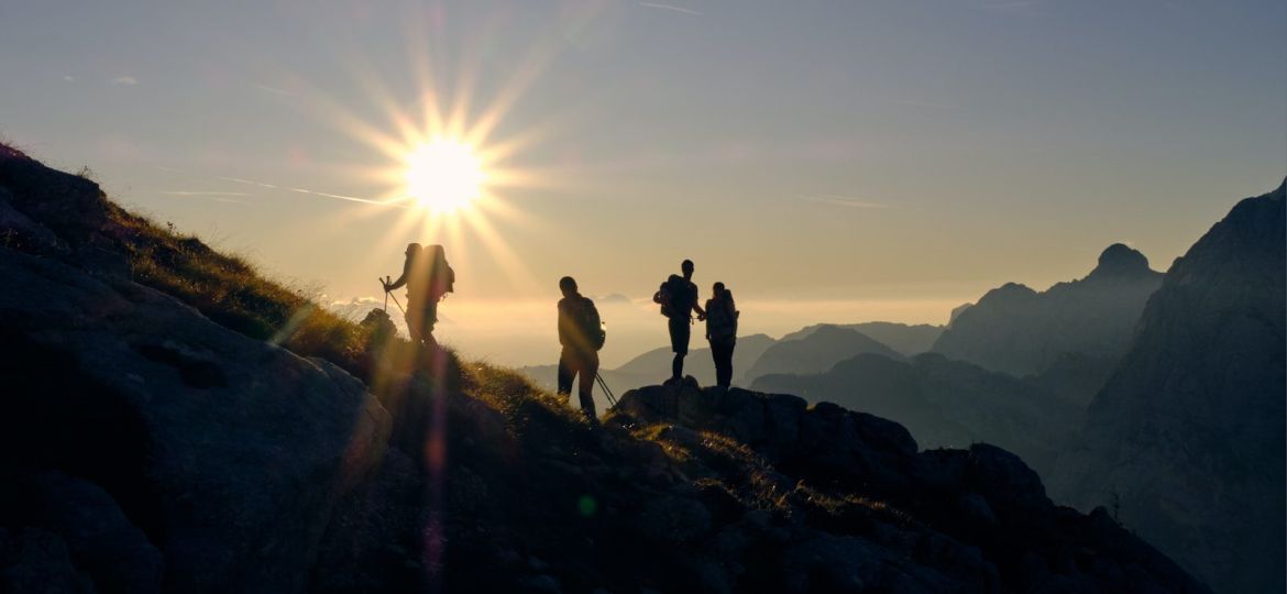 four person on mountain during daytime