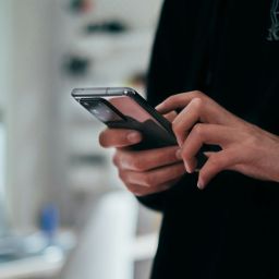 person holding black android smartphone