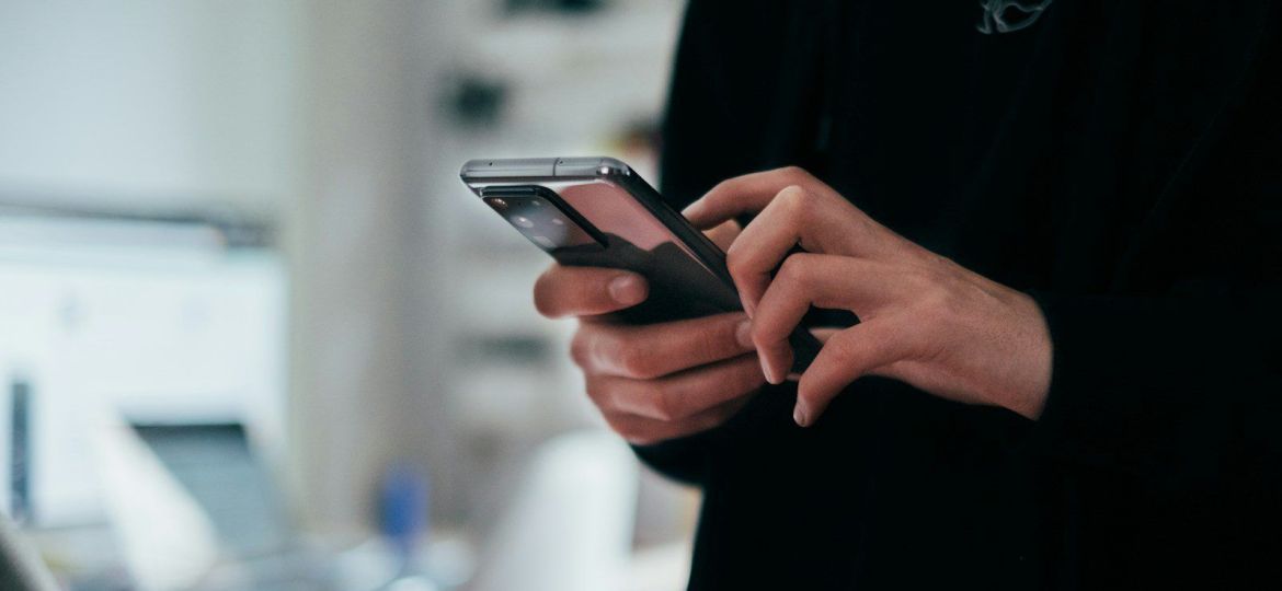 person holding black android smartphone