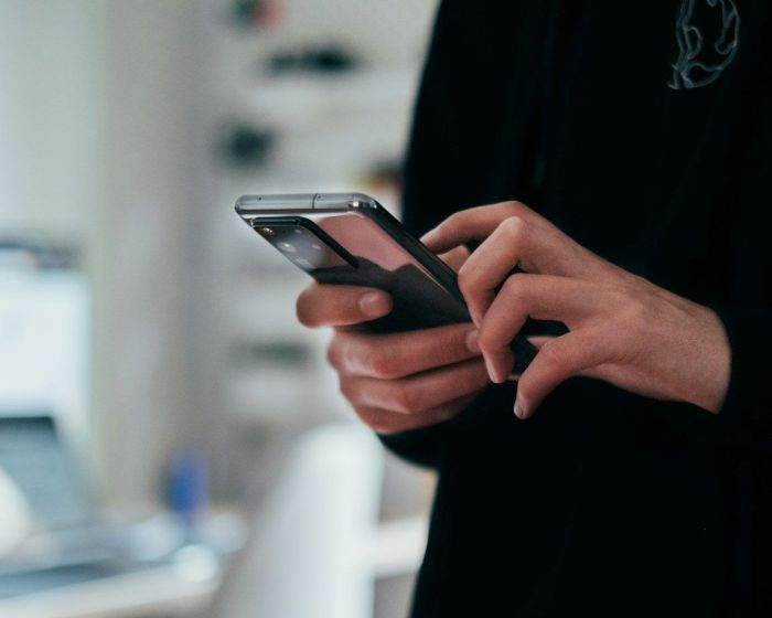 person holding black android smartphone